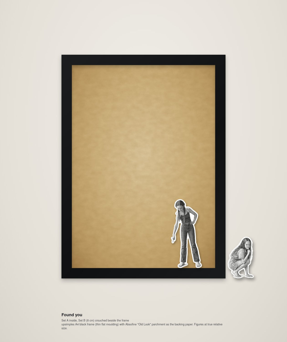 Found You – framed wall art with two wooden figures playing hide and seek (A4)