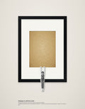 Hanging On – framed wall art with a wooden figure who has nipped out (A4)