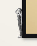 Measuring Up – close-up of the wooden figure on the black frame